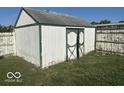 White shed with green trim in backyard at 905 Crescent Dr, Anderson, IN 46013