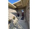Covered front entry with brick facade and potted plants at 2170 Galleone Way, Plainfield, IN 46168