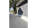 Side yard with concrete driveway and mature tree at 3131 Boulevard Pl, Indianapolis, IN 46208