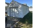 Detached garage with white siding and a single door at 616 W 38Th St, Anderson, IN 46013