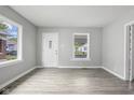 Bright living room featuring hardwood floors and large windows at 1472 N Grant Ave, Indianapolis, IN 46201