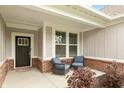 Front porch with brick details and comfortable seating at 750 Keck Way, Westfield, IN 46074