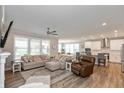 Open living space with kitchen, island, and hardwood floors at 750 Keck Way, Westfield, IN 46074