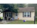 Tan house with front yard and landscaping at 3816 St Charles St, Anderson, IN 46013