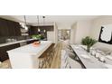 Open concept kitchen with island, stainless steel appliances, and dining area at 5736 Birtz Rd, Indianapolis, IN 46216