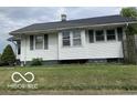 White single story home with a grassy lawn at 1317 W Memorial Dr, Muncie, IN 47302