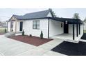 White brick home with covered porch and walkway at 2068 S Avon Ave, Avon, IN 46123