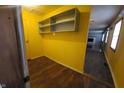Laundry area with wood flooring and shelving at 544 Sweetbriar Ave, New Whiteland, IN 46184