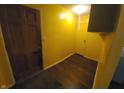 Bright yellow entryway with wood flooring and doors at 544 Sweetbriar Ave, New Whiteland, IN 46184