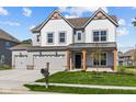 Two-story home with gray siding, white accents, and a three-car garage at 10620 Banyan Wood Ct, Indianapolis, IN 46239