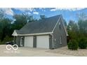 Detached three car garage with gray brick exterior at 4270 Victoria Ln, Avon, IN 46123