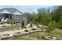 Landscaped yard with a walkway and various plants at 4270 Victoria Ln, Avon, IN 46123