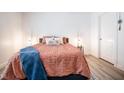 Cozy bedroom with a coral comforter and blue blanket at 1431 Coen Ct, Columbus, IN 47201