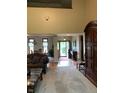 Spacious entryway with high ceilings, showing views into the living room and dining areas at 466 Sycamore Ridge Ct, Avon, IN 46123