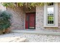 House entrance with red door and brick facade at 466 Sycamore Ridge Ct, Avon, IN 46123