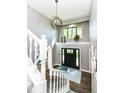 Two story foyer with a grand staircase and large windows at 5826 Winding Way Ln, Indianapolis, IN 46220
