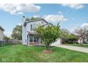 Two-story home with gray siding, brick accents, and attached garage at 17830 Sundial Dr, Noblesville, IN 46062