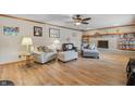 Living Room with fireplace, comfortable seating, and hardwood floors at 1061 Saint Paul St, Shelbyville, IN 46176