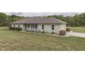 Ranch style home with attached two-car garage and landscaped yard at 5391 Neff Ln, Mooresville, IN 46158