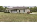 Ranch style home with covered porch and landscaping at 5391 Neff Ln, Mooresville, IN 46158