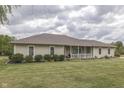 Ranch style home with covered porch and landscaping at 5391 Neff Ln, Mooresville, IN 46158