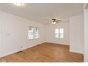 Spacious living room featuring hardwood floors and a ceiling fan at 309 N Lasalle St, Indianapolis, IN 46201