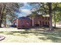 Brick house with large yard and mature trees at 10909 Wonderland Dr, Indianapolis, IN 46239