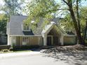 Tan brick house with gray roof, columns, and landscaping at 10781 Cedar Ridge Ln, Brownsburg, IN 46278