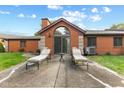 Brick patio with lounge chairs, offering a relaxing outdoor space at 9263 Golden Oaks W, Indianapolis, IN 46260