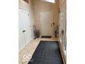 Bright foyer with tile flooring and double closets at 4161 S Summit Ln, Columbus, IN 47201