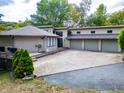 Lakefront home with three-car garage and circular driveway at 4161 S Summit Ln, Columbus, IN 47201