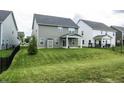 Private backyard with a large grassy area at 6390 Torrington St, Brownsburg, IN 46112