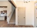 Bright entryway with staircase and view into kitchen area at 3657 Sycamore Bend S Way, Columbus, IN 47203