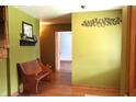 Inviting entryway with wood bench and access to other rooms at 7534 E Fox Hill Dr, Camby, IN 46113
