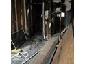 Fire damaged interior, debris and exposed framing at 814 S State Ave, Indianapolis, IN 46203