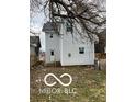 Rear view of house, white siding, small deck at 814 S State Ave, Indianapolis, IN 46203