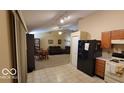 Open kitchen with view of living room and dining area at 5347 Waterton Lakes Dr, Indianapolis, IN 46237