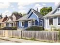 Blue house with white door and black accents at 1526 Lawton Ave, Indianapolis, IN 46203