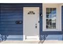 White front door and blue exterior at 1526 Lawton Ave, Indianapolis, IN 46203