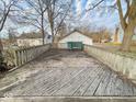 Large wooden deck provides an outdoor space for relaxation and entertainment at 712 W Queen St, Muncie, IN 47303