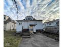 Back of house shows access to backyard and additional exterior features at 712 W Queen St, Muncie, IN 47303