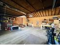 Attached garage with built-in shelving and workbench at 4839 Alameda Rd, Indianapolis, IN 46228