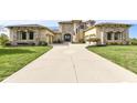 Luxury home with stone and stucco exterior and three car garage at 10881 Harbor Bay Dr, Fishers, IN 46040