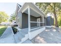Newly renovated grey house with a front porch at 1521 Indiana Ave, Columbus, IN 47201