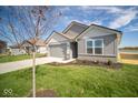 Two-story home with gray siding and attached garage at 1114 Fleming Dr, Greenfield, IN 46140