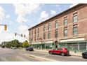Brick building with commercial storefront and street parking at 970 Fort Wayne Ave # 301, Indianapolis, IN 46202
