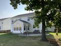 Backyard patio with seating and sunroom addition at 5211 Nicodemus Dr, Plainfield, IN 46168