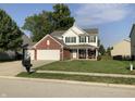 Two-story brick house with a two-car garage at 5211 Nicodemus Dr, Plainfield, IN 46168