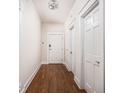 Bright hallway with hardwood floors and neutral-colored walls at 970 Fort Wayne Ave # 301, Indianapolis, IN 46202