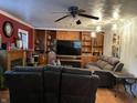 Spacious living room with built-in shelving and a large TV at 3991 Bennett Dr, Indianapolis, IN 46254